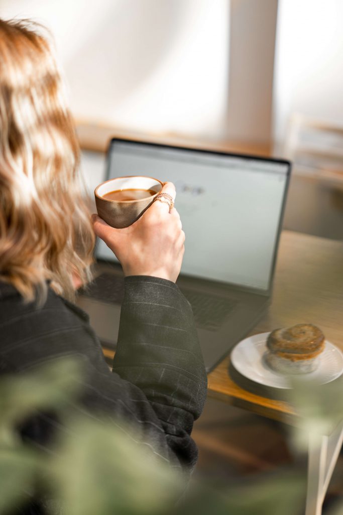 lady working with cup of coffee